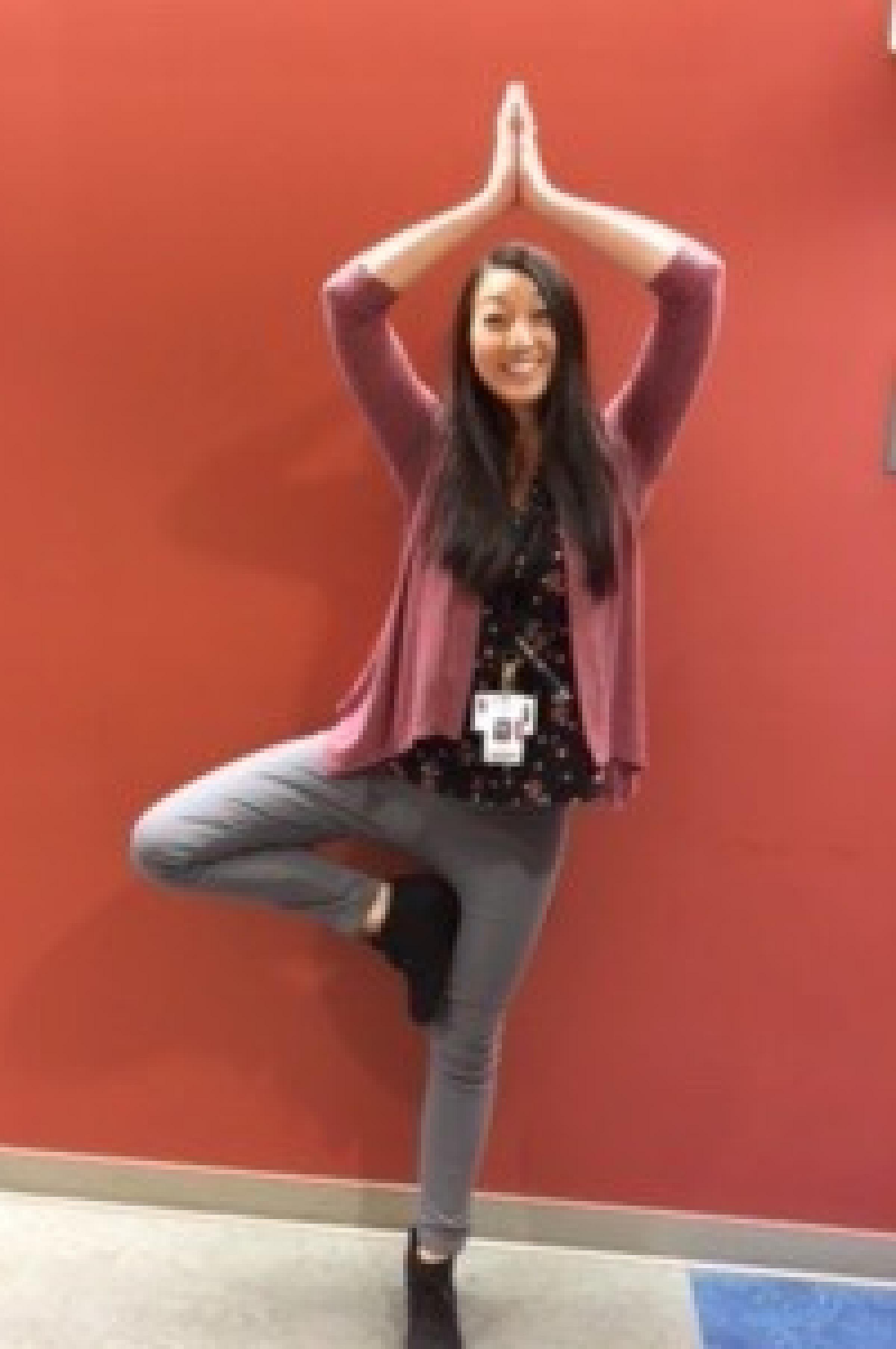 MD resident in tree pose
