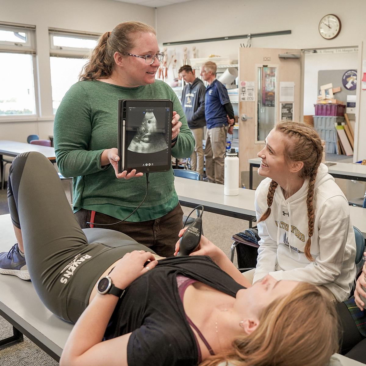 MD Students shoes high school class how to conduct an ultrasound on a portable device and iPad