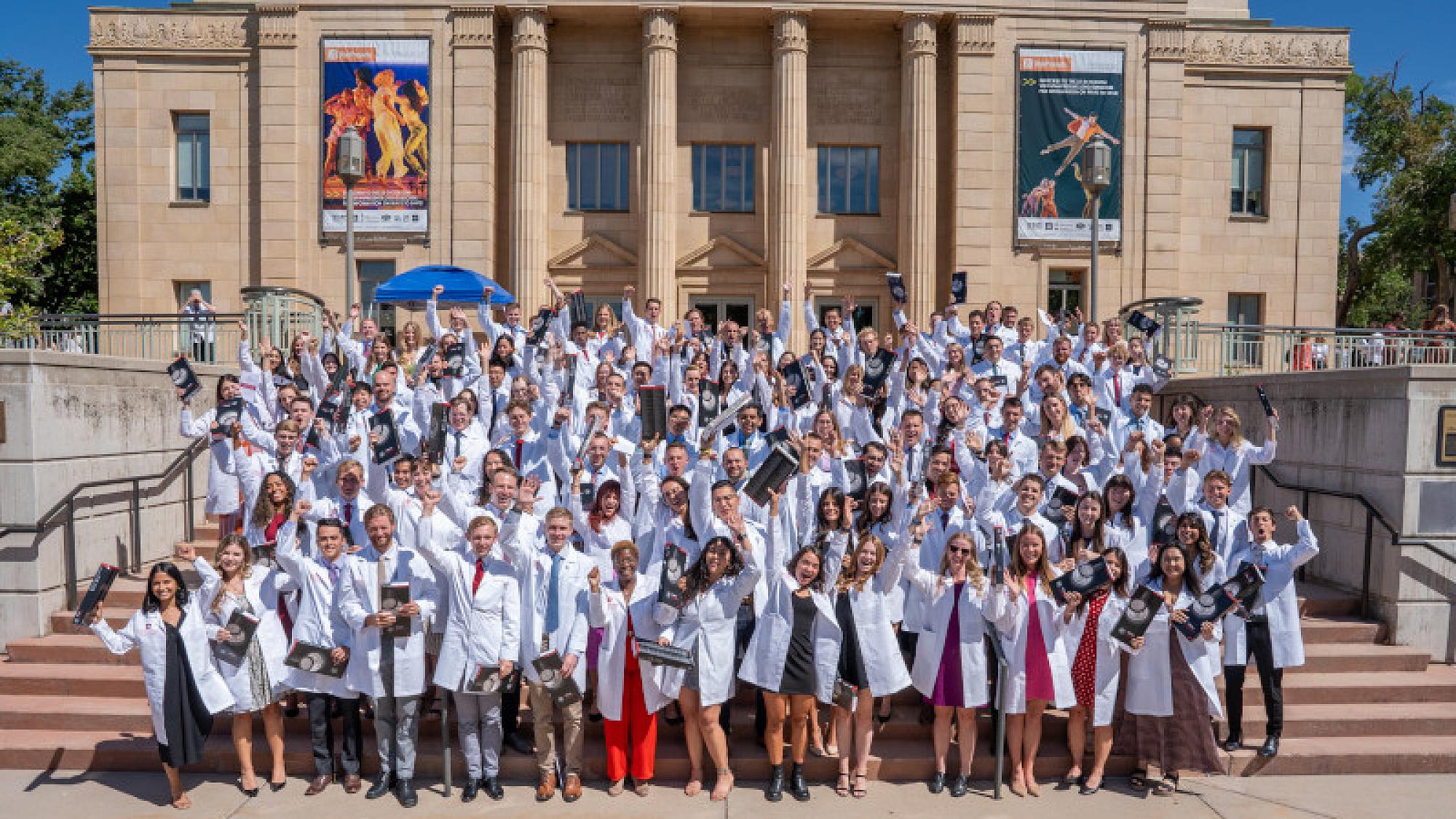 The Spencer Fox Eccles School of Medicine Class of 2027 poses for a photo at the 2023 White Coat Ceremony outside Kingsburry Hall 